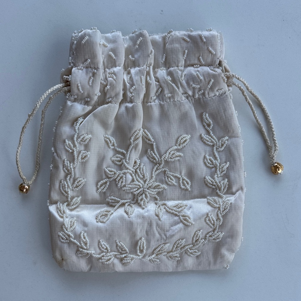 Elegant Cream Embroidered Drawstring Bag
